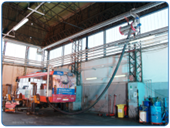 Smoke and exhaust gases extraction in bus garage by retractable pipe connected to a central suction system