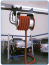 A smoke extraction retractable pipe on rails for smoke suction from vehicles, trucks and buses